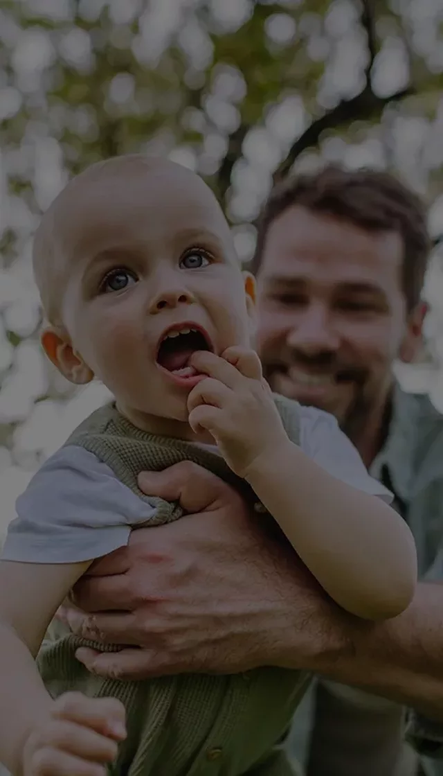 Father holding little baby