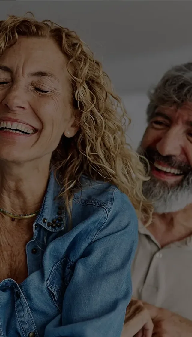 Over 60s senior couple laughing together
