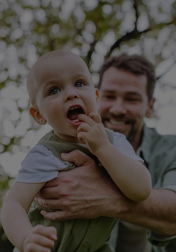 Father holding little baby