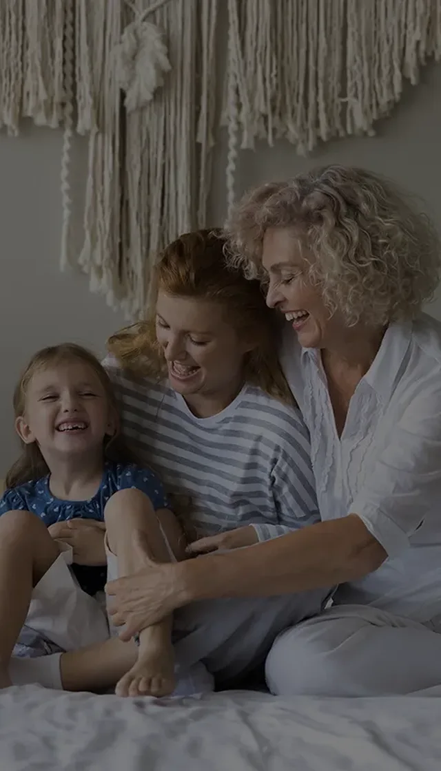Happy grandmother over 50 with family at home