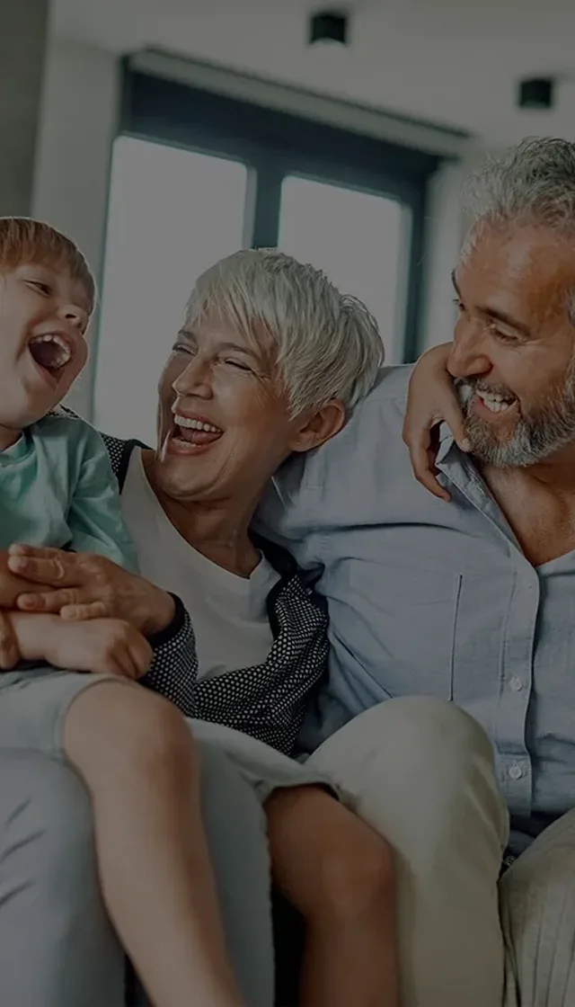 Grandparents having fun with grandchildren at home