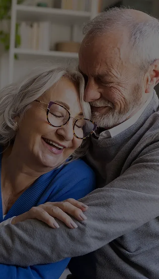 Cuddling senior couple over 50