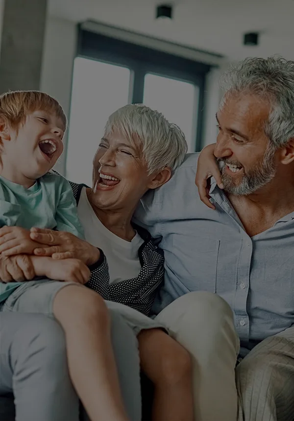 Grandparents having fun with grandchildren at home
